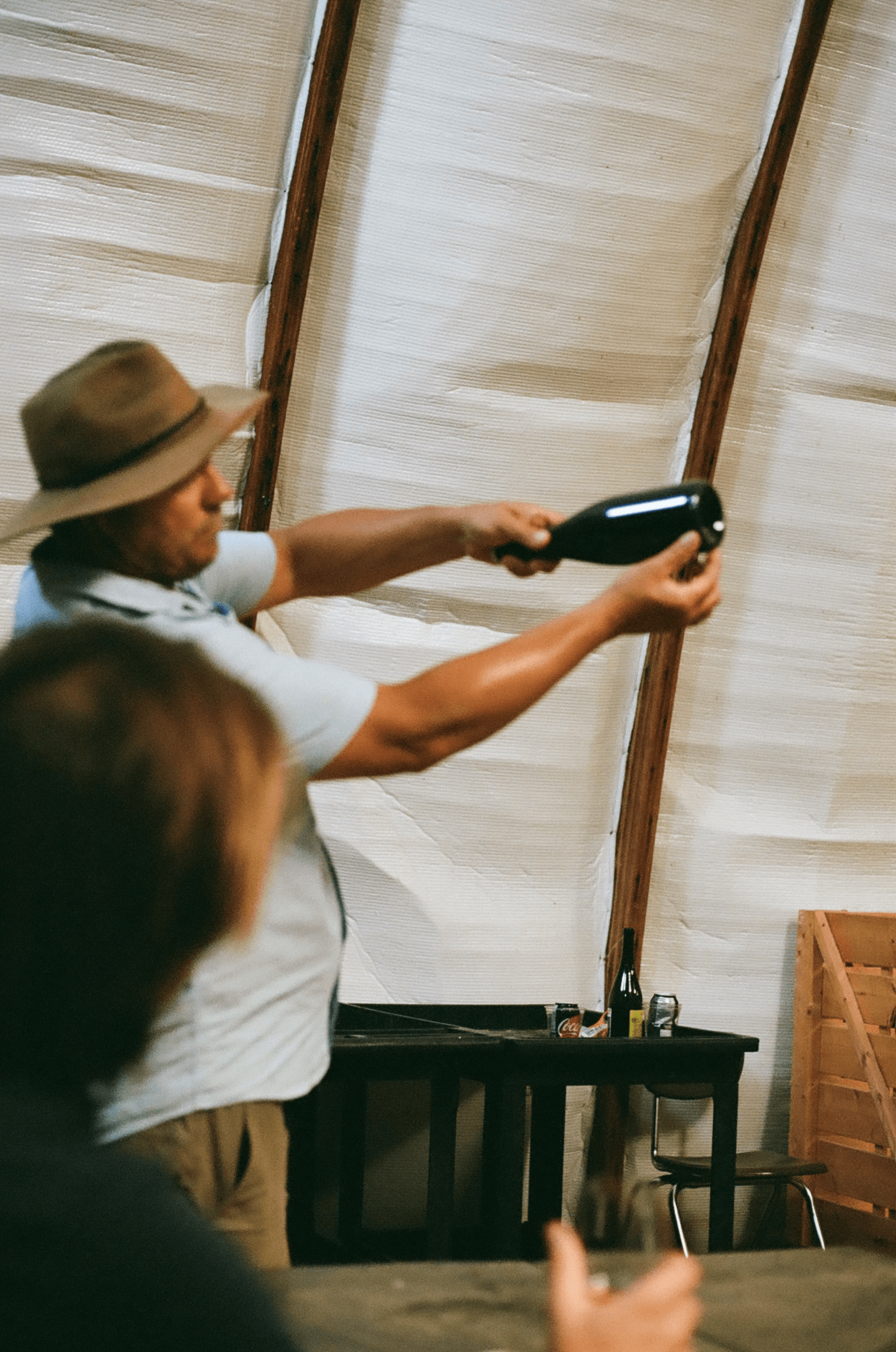 Winemaker presenting a bottle during a tasting